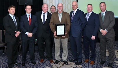 Posing with the company’s Achievement Award recipient are, from left, Phil Key, president; Tom Barry, vice president of Ruppert’s landscape management division; Bob Jones, president of the landscape construction division; Doug Halsey, regional vice president, landscape management division; the award recipient, Tony Youngblood, field manager, Georgia landscape construction branch; Craig Ruppert, chief executive officer; Jack Jones, region manager, landscape management division; and Chuck Whealton, region manager, landscape management division. Photo: Ruppert Landscape