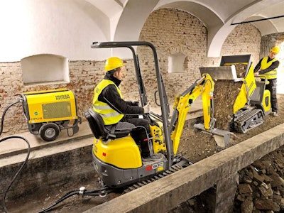 Wacker Neuson’s dual-power 803e excavator and electric DT10e dumper are shown here working on an indoor demolition job. Photo: Wacker Neuson