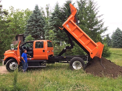 Delivering the dirt and backing the truck down a tight driveway – while simultaneously trying to avoid trees and a barn – was hardly a challenge. Photo: Ford