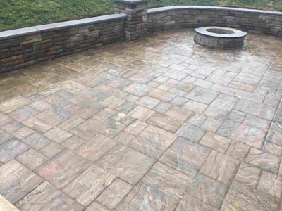 The finished project includes a fire pit, retaining wall and putting area. Photo: EP Henry