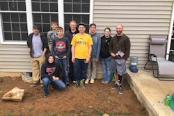 Several of the students who worked on the project pause for a photo with Vince Reynolds (far right). Photo: EP Henry