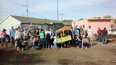 Victory Garden Blitz volunteers celebrate a record effort in 2016, bringing the total number of gardens installed to more than 3,000 since the program began. Photo: Case Construction Equipment
