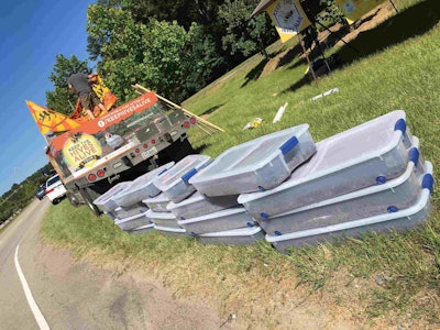 Tubs of dead bees on display in front of Bayer Crop Science’s North American Headquarters. Photo: Keep the Hives Alive Tour