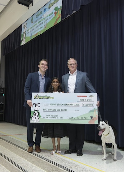 Kashvi Ramani poses with Casey Mindlin, left, regional director for Scholastic National Partnerships, and Kris Kiser, president and CEO of the Outdoor Power Equipment Institute … and oh yes, Lucky, the TurfMutt.
