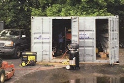 The landscaping company was working out of several storage containers in the parking lot of a furniture store. Photo: The Island Now