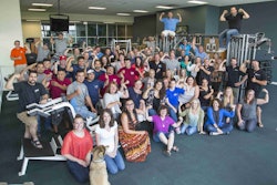 Aquascape employees show off their muscles after the company is declared one of the healthiest in America. Photo: Aquascape Inc.