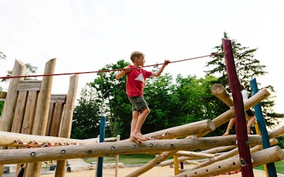 Natural playgrounds allow children to explore and challenge themselves with a little risk involved. Photo: Earthscape