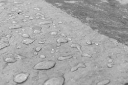 This before/after photograph shows the results of using AQUA-XTM 11 sealer on a concrete surface. Photo: Black Diamond Coatings