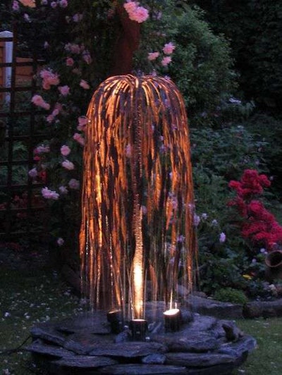 During night and day this weeping willow water feature is the center of the show. Photo: water-garden.co.uk