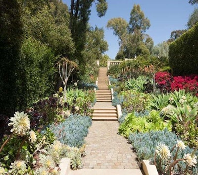 This garden features succulents and exotic plants, paying tribute to Lotusland. Photo: Zillow