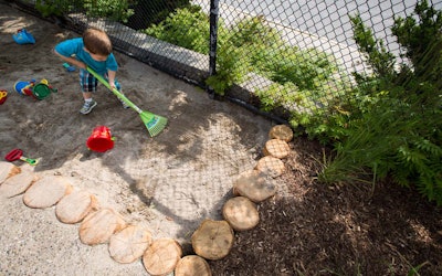 Playing with loose materials like sand allows children to construct and be imaginative. Photo: Earthscapes
