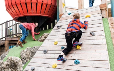 Rather than climbing even stairs, children can choose a hilly slope or a rock climbing wall to reach the top. Photo: Earthscape