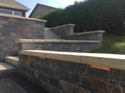 Construction of Unilock Olde Quarry retaining walls couldn’t begin until a great deal of tear-down work and other site preparation was complete. Photo: Greenscapes
