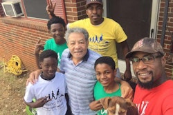 After finishing a job, Smith and his young men will take a picture with the homeowner they helped. Photo: Raising Men Lawn Care Service