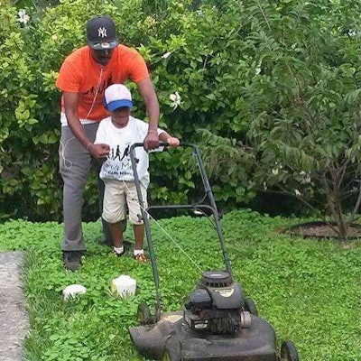 Smith teaches kids not only how to cut lawns, but leadership and teamwork skills as well. Photo: Raising Men Lawn Care Service