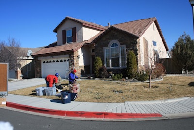 Signature Landscapes’ employees worked hard to put up the Christmas lights to surprise the family while they were out of the house. Photo: Signature Landscapes