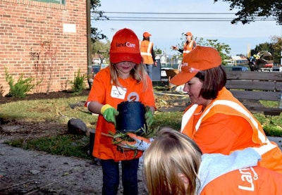 LandCare employees brought family members along to join in the volunteer effort. Photo: LandCare