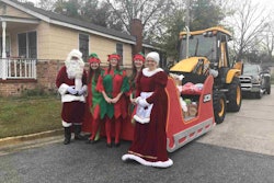 Upon arrival at the Lady Bamford Center in Savannah, Georgia, Santa and his crew prepare to greet the kids next to his sleigh, which is attached to a JCB 3CX backhoe. Photo: JCB