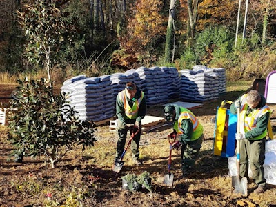 Ruppert Landscape and Habitat for Humanity volunteered to spruce up Reid Park. Photo: Project EverGreen