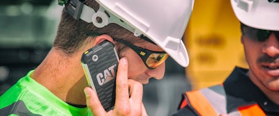 Construction Worker Talking on his Smart Phone