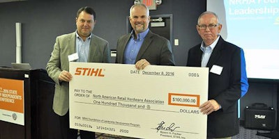 Roger Phelps presents $100,000 to the NRHA during its 2016 State of Independents Conference in Chicago.