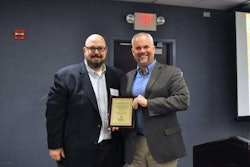 STIHL’s corporate communications manager, Roger Phelps, accepts award from NRHA Vice President of Publishing Dan Tratensek.