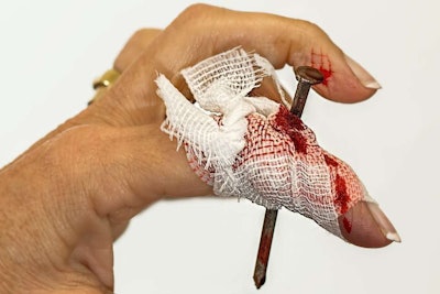 Woman's Hand Injured by Nail Piercing Her Finger