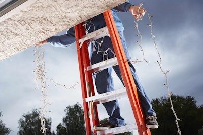 Be sure to move the ladder as needed to avoid overreaching and losing your balance. Photo: Frye Electric Inc.