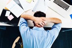 man-face-down-on-desk