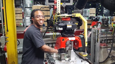 Laquan Fenderson, a Briggs & Stratton worker, works on building the Milwaukee plant’s 1 millionth pressure washer. Photo: Briggs & Stratton Corp.