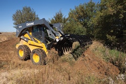The height and width of the root rakes help protect the front of the machine from damage. Photo: John Deere