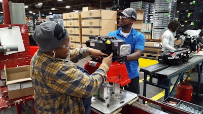 Briggs & Stratton workers build the 1 millionth pressure washer at the company’s Milwaukee Burleigh Facility. Photo: Briggs & Stratton Corp.