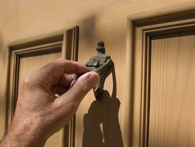 A Man Knocking on Someone's Front Door