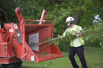 Morbark’s ChipSafe Operator Safety Shield device stops the feed wheel of a chipper if an operator’s hands or feet, equipped with ChipSafe wearable accessories, go too far into the infeed chute. Photo: Morbark