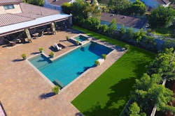 Although their client was pleased with Hillside Pavers’ hardscape work, they didn’t like the look of their lawn next to it. Hillside solved the problem by installing more than 1,500 square feet of artificial grass for the client. Photo: Synthetic Grass Warehouse