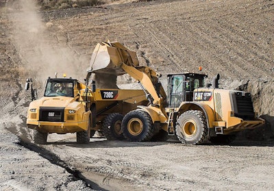 A Cat 972M loads an articulated truck.