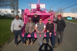 Stacey Marcell (center) and her crew pose in front of her iconic pink wood chipper. Photo: Northeast Horticultural Services