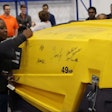 Team members commemorated the event by signing the XAS 185 portable air compressor as it exited the product line. Photo: Atlas Copco