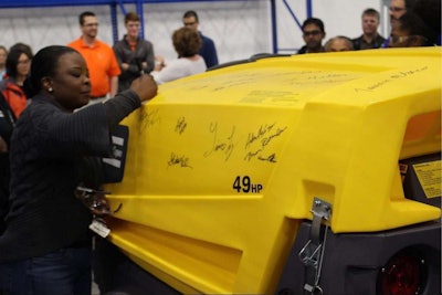 Team members commemorated the event by signing the XAS 185 portable air compressor as it exited the product line. Photo: Atlas Copco