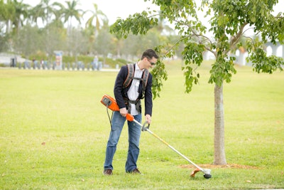 The string trimmer features a two-way head rotation so the user can direct the clippings. Photo: Husqvarna
