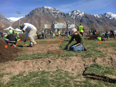 Three-man teams of students rushed to install plants and sod on their plots in the hour and 50 minutes provided for the plant installation event. Photo: Jill Odom