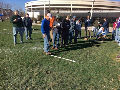 John Hemphill shows how to flush a drip zone of debris. Photo: Jill Odom