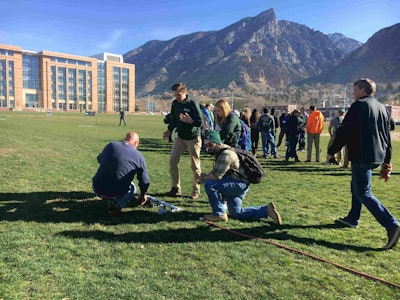 Students study the different type of sprinkler heads and the optimal psi needed. Photo: Jill Odom
