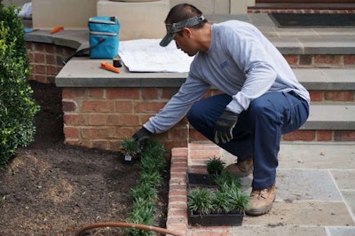 This Arborscapes employee’s uniform helps him look more professional and also protects him from skin cancer. Photo: Patty Vaughan