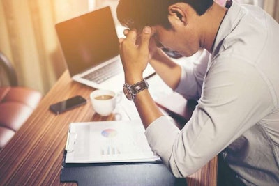 man stressing over landscape company ownership