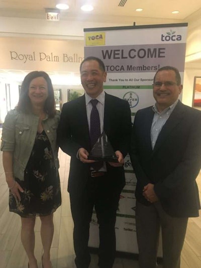 Pictured from left to right are Project EverGreen Executive Director Cindy Code with Dr. Frank Wong, Bayer CropScience, and Jose Milan, Bayer CropScience, following the award presentation at the TOCA Annual Conference. Photo: Project EverGreen