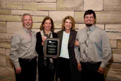 Pictured are the family and friends of Dave Nelson, accepting the award on his behalf. Photo: ALCC