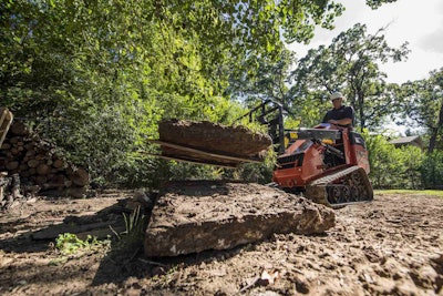 The Ditch Witch SK1050 uses a pallet fork attachment to move material around on a job site. Photo: Ditch Witch