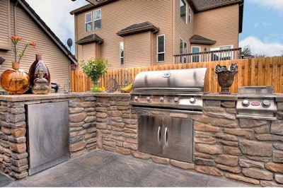 This outdoor kitchen was designed and constructed by Paradise Restored Landscaping in Portland, Oregon. Photo: Media Director/Flickr