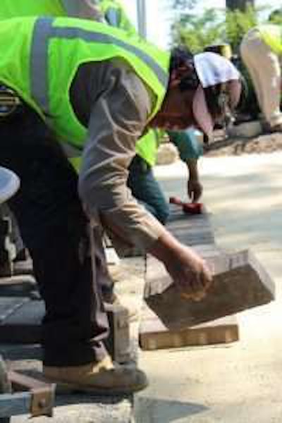 Joe Markell and his crew at Sunrise Landscape and Design work on a covered seating area in Arlington. Photo: Beth Hyatt